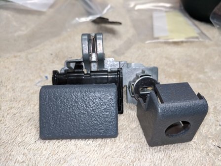 003-Plastic trim ready to be snapped back on latch-Lock assembly.jpg