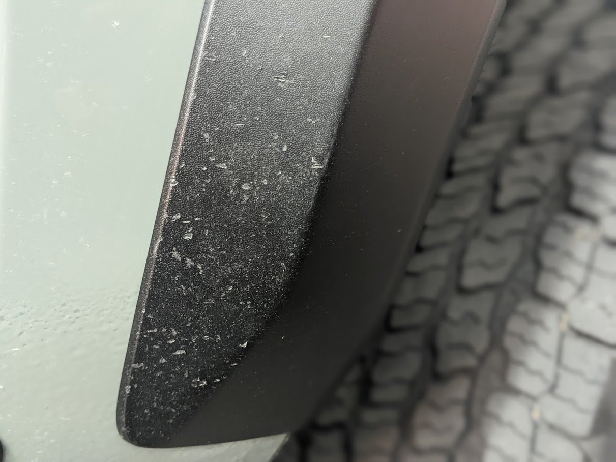 Is there a trick to keep fender flaires looking black?