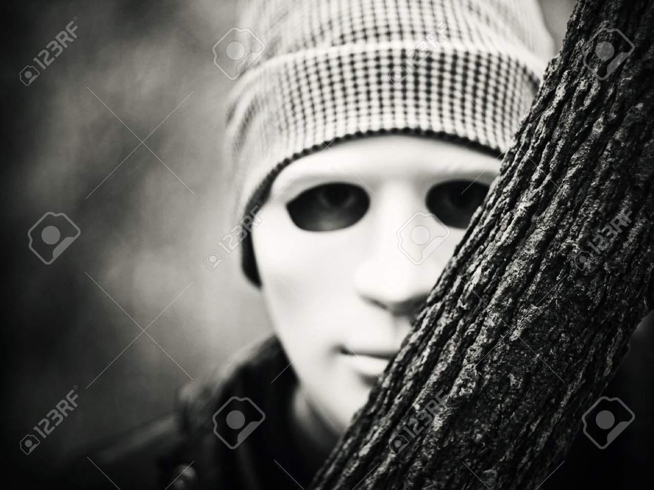 11201514-man-with-white-mask-peeking-behind-tree-Stock-Photo-scary.jpg