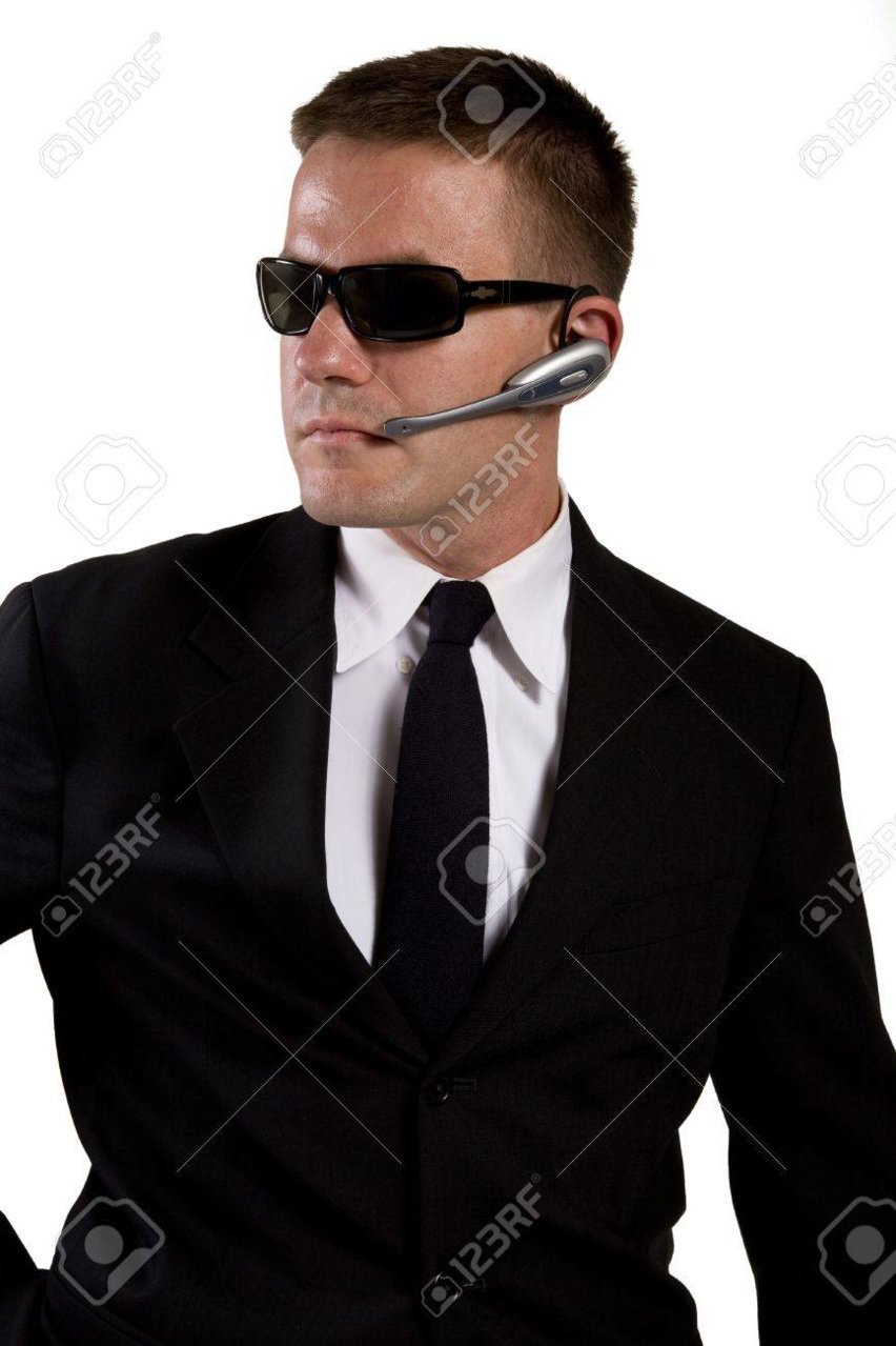 16638622-secret-agent-reaches-for-gun.jpg