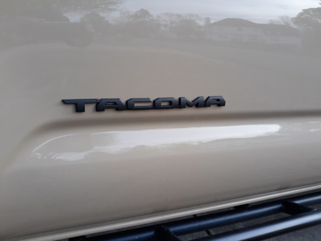 OEM Black Tacoma decal; not Overlay.