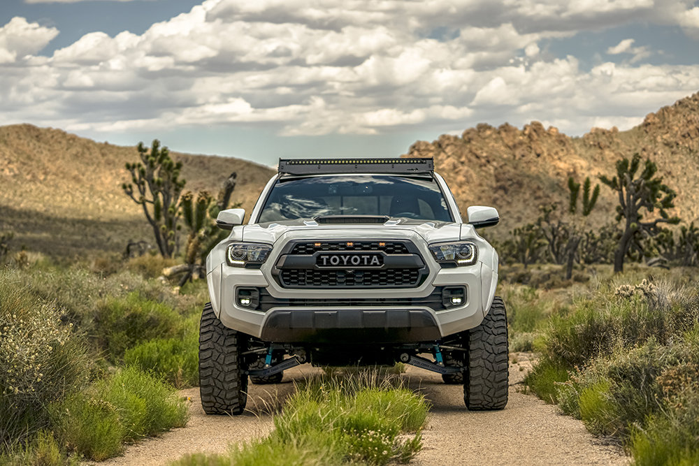 4-01-long-travel-tacoma-head-on-desert.jpg