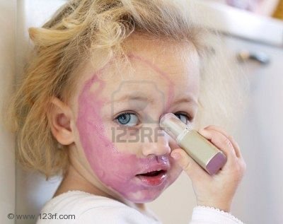 5178074-a-child-painting-her-face-with-lipstick.jpg