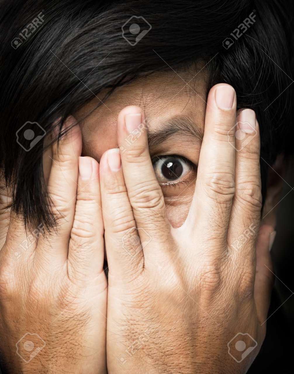 72968772-human-hand-cover-up-the-face-and-remaining-one-eye-be-scared-concept.jpg
