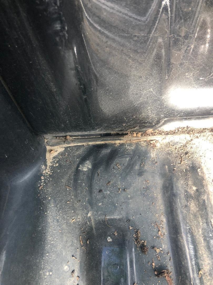 '97 bed drain driver side.jpg