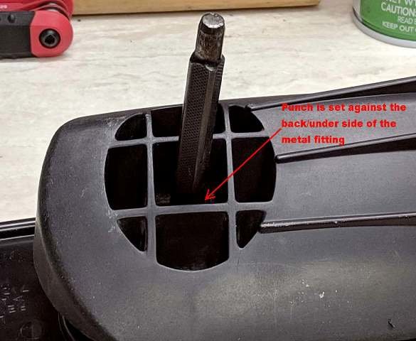 Adjusment of tension of ball in socket-Punch set on backside to secure the fitting 585x480.jpg
