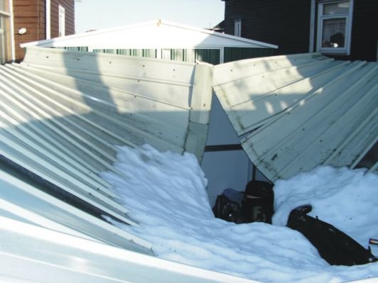 Collapsed-metal-shed-roof-1232589753.jpg