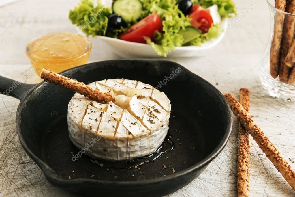 depositphotos_148478637-stock-photo-baked-camembert-cheese-in-a.jpg