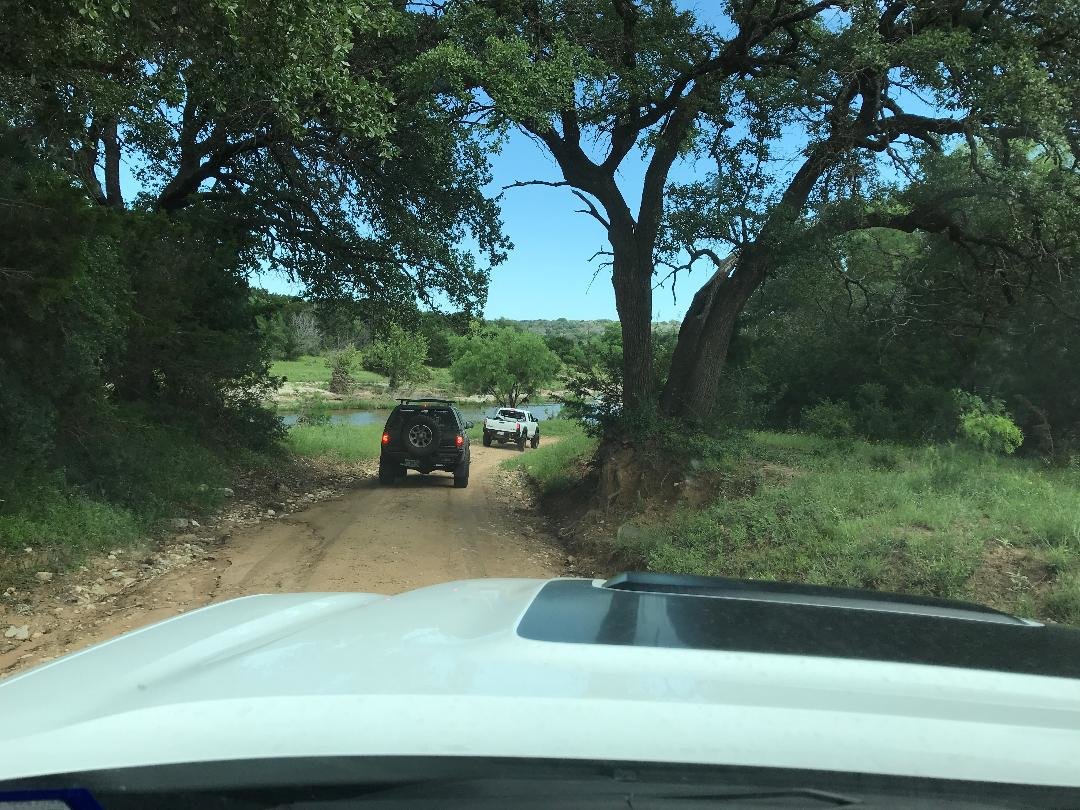 Dirt road next to river.jpg