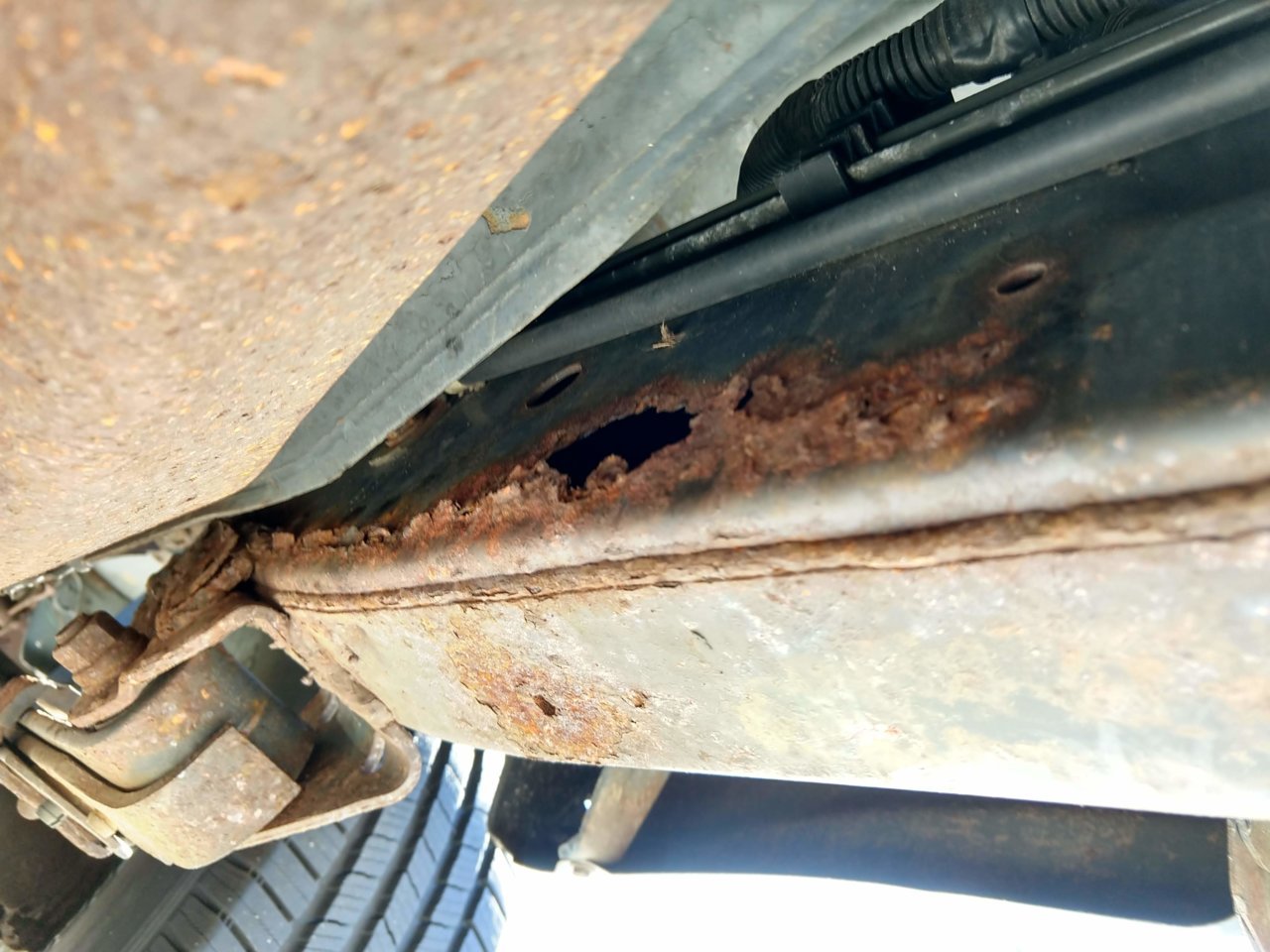 driver side frame rot.jpg