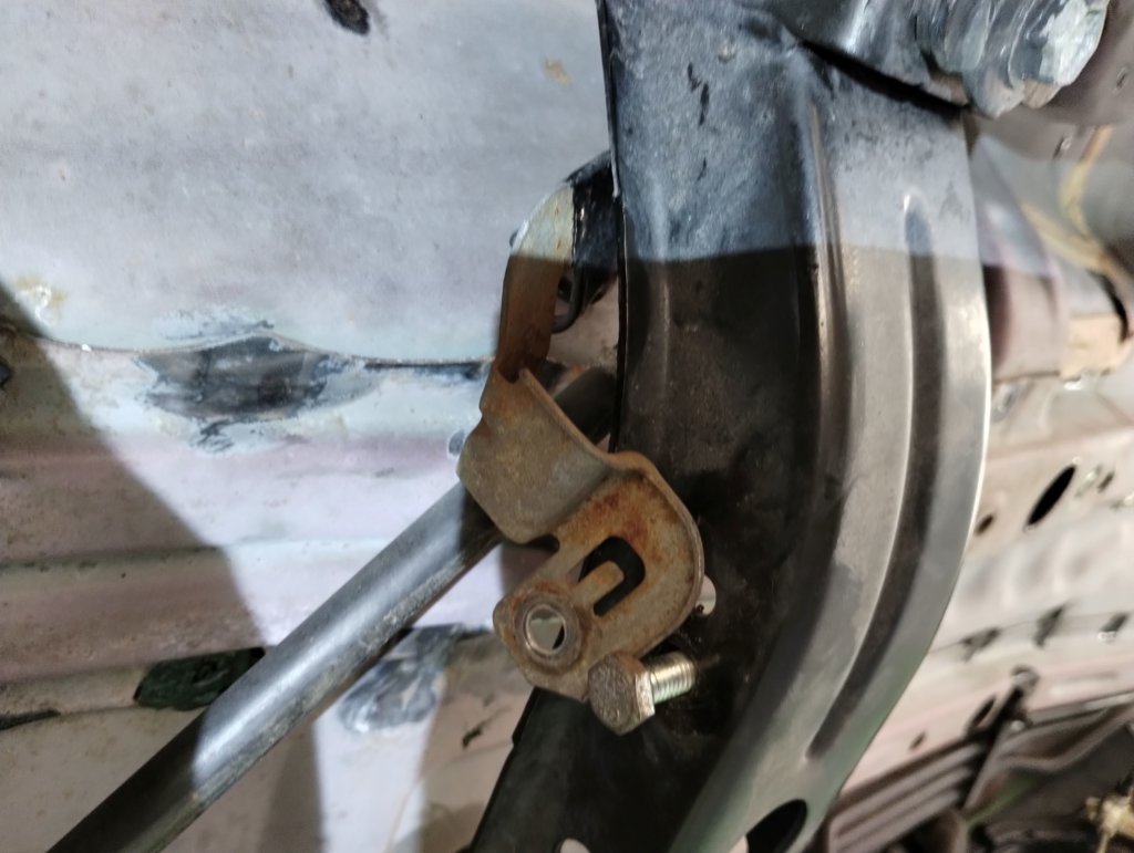Driver Side Parking Brake Line Bracket Rusty.jpg