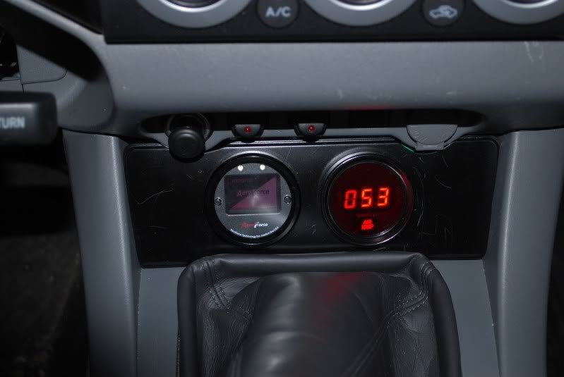Square temperature gauge, velcro anywhere, size of a keychain remote.  Tempterature gauges read air intake temperature or water temperature.  Tunning with a water temperature gauge is critical. - Square temperature  gauge, velcro