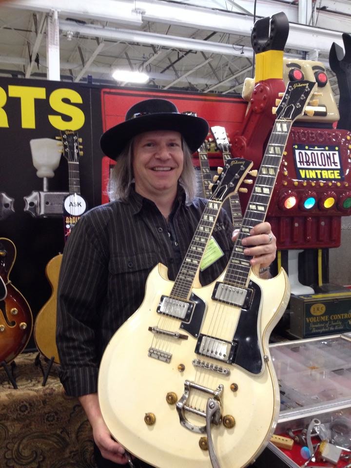 Eric-Ernest-of-Abalone-Vintage-with-a-rare-50s-Gibson-doubleneck.jpg
