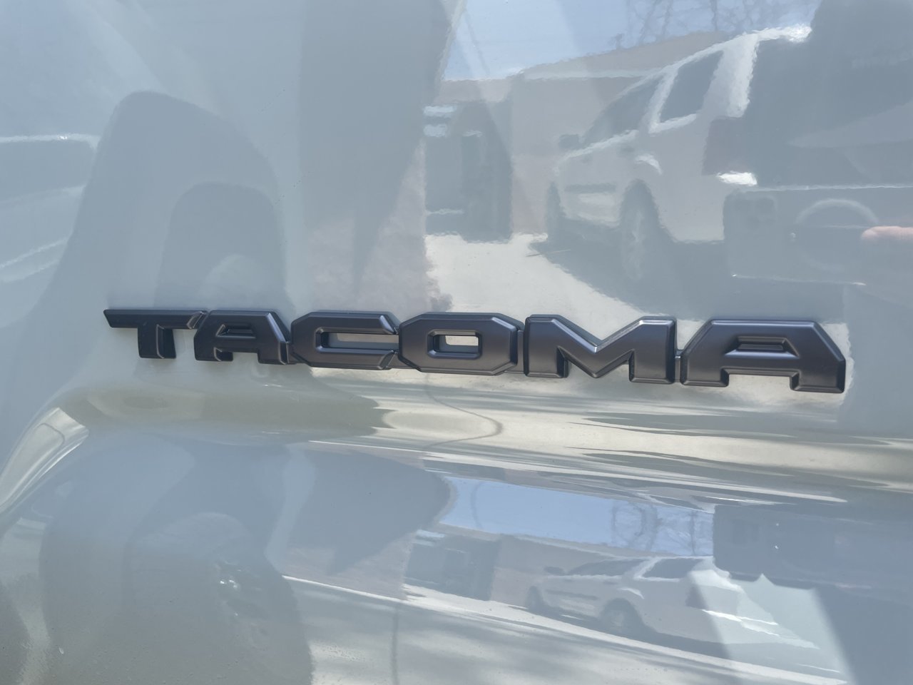 OEM Black Tacoma decal; not Overlay.