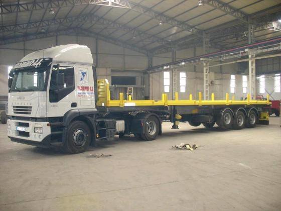 Flatbed_Semi_Trailer_-_Container_Carrier_Trailer.jpg