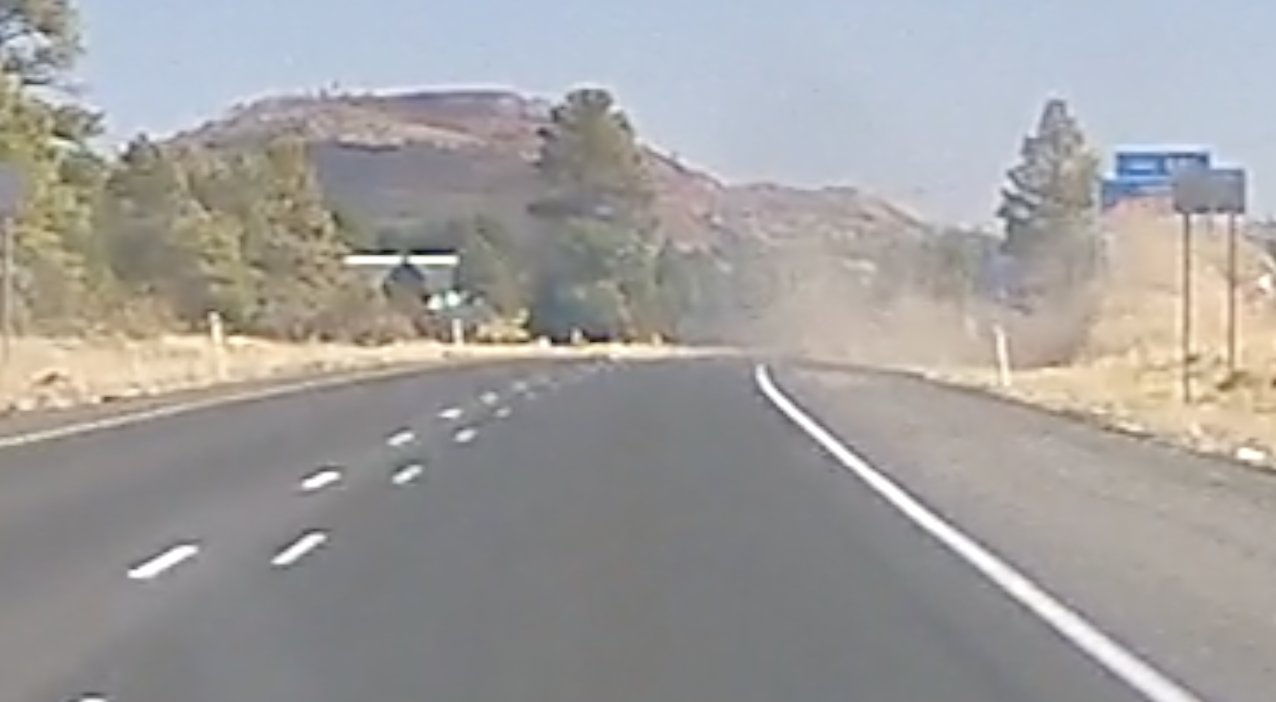 FlipsOntoSideRoad.jpg