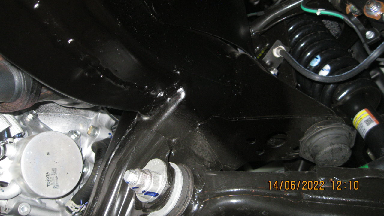 frame under engine and shock assembly.jpg