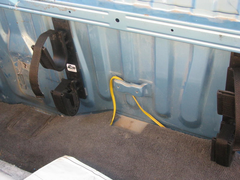 Gun rack mounted behind seat.jpg