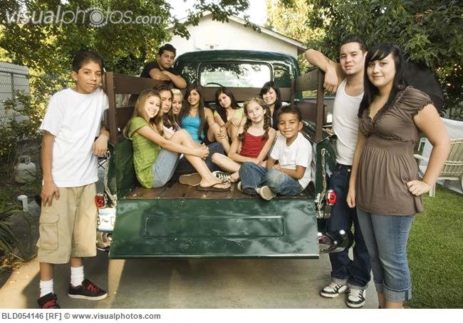 hispanic_teenagers_and_young_adults_in_back_of_truck_BLD054146.jpg