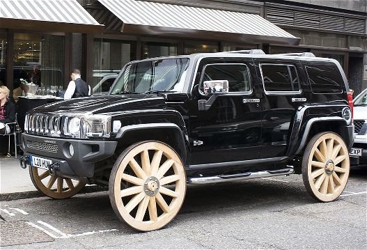 hummer-h3-with-wagon-wheels_28b1e37abb0d47bd242ec3c679465e2f06a215ea.jpg