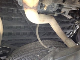in front of the spare = no good, i have dual exhaust .jpg