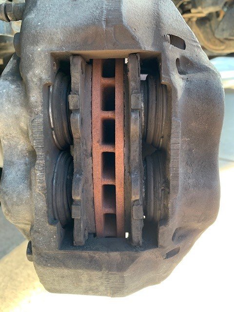 Front brake pad spring orientation? Uneven pad wear (6 lug