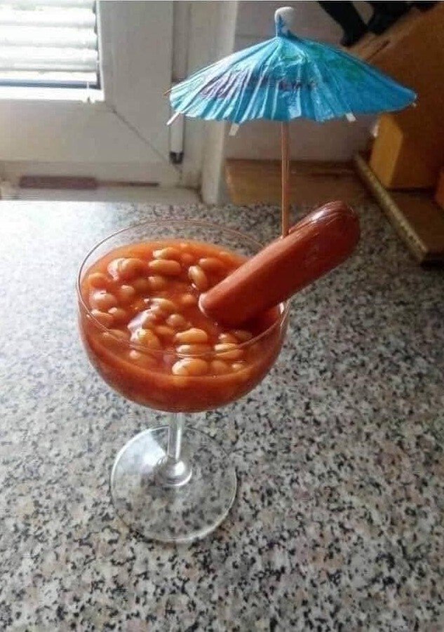 more-quarantine-recipes-above-a-photo-of-a-hot-dog-in-a-glass-with-beans-and-a-cocktail-umbrella.jpg