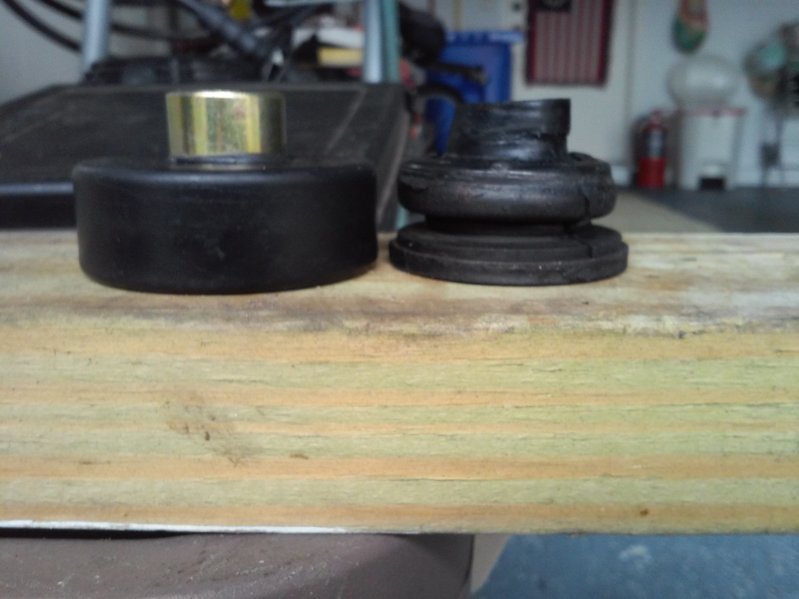 new and old upper bushing.jpg