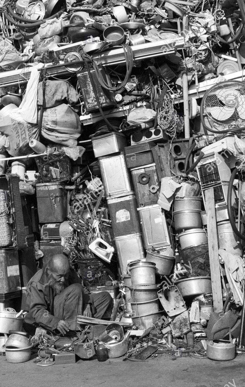 old-man-tinkering-in-junkyard-B3T854~2.jpg