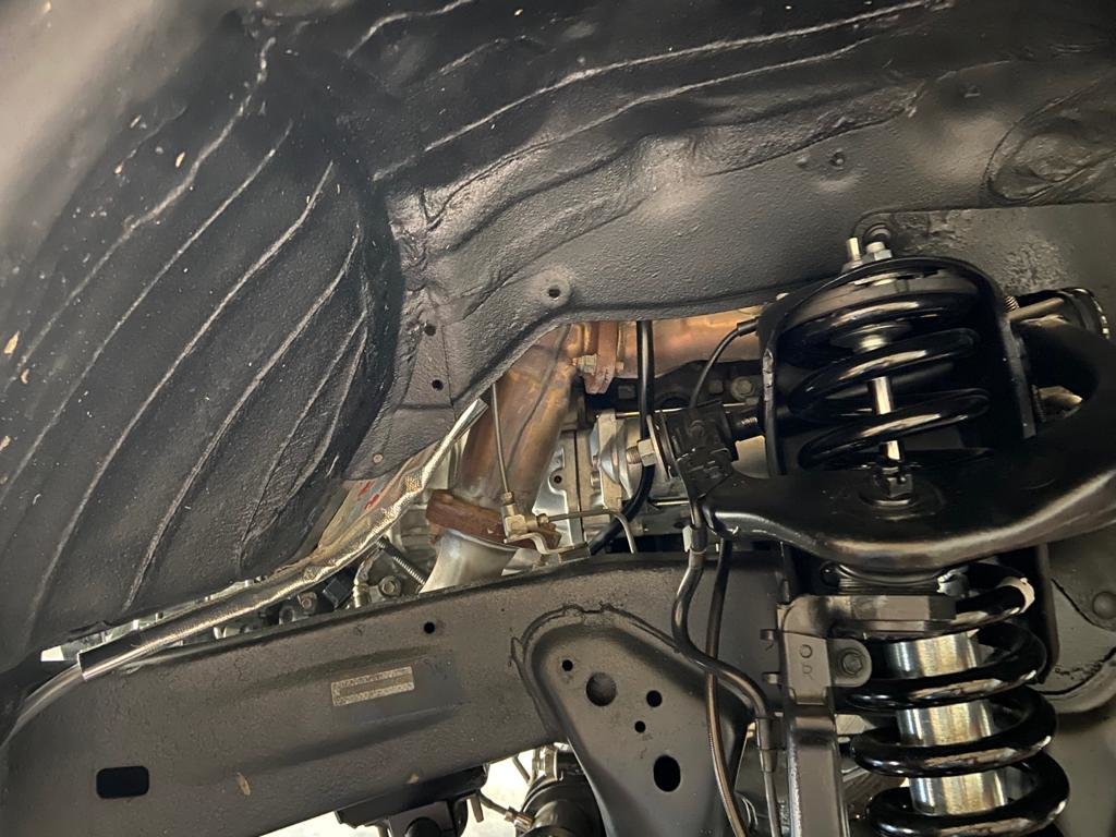 Passenger tire removed access to heat shield.jpg