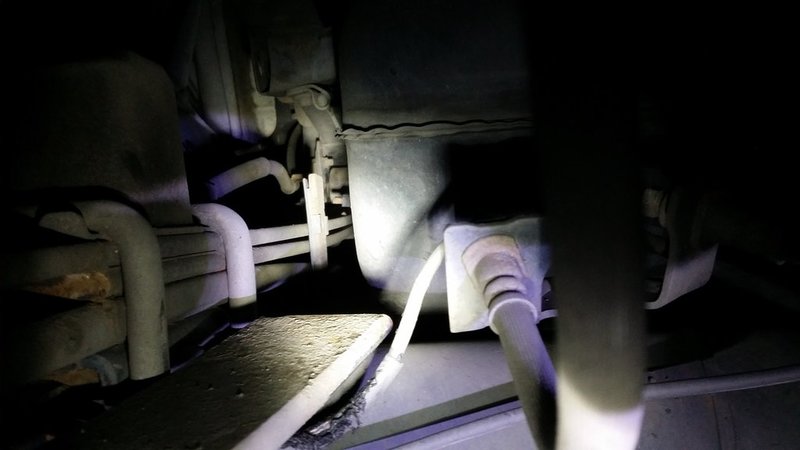 piece-of-spring-pointing-at-gas-tank.jpg