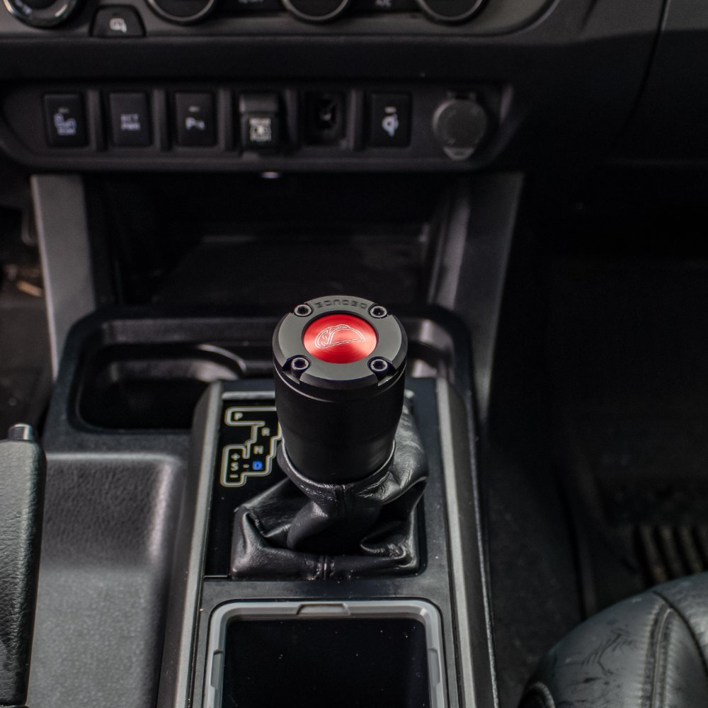 Automatic shift knobs with deals top button