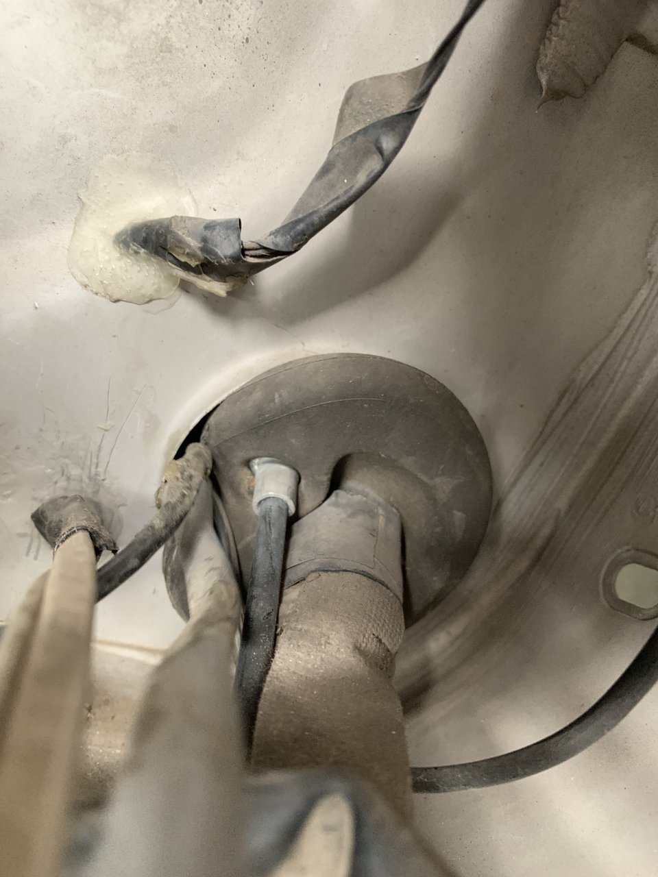 Removing Previous Owner Janky Wiring Through Grommet.jpg