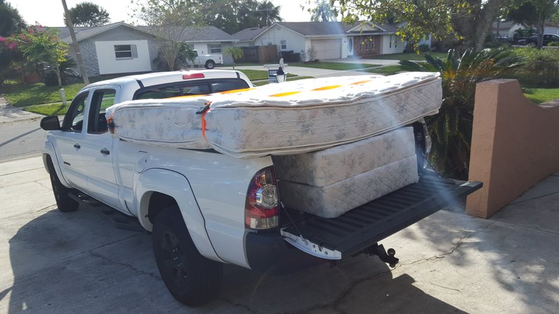 king size mattress on pickup truck