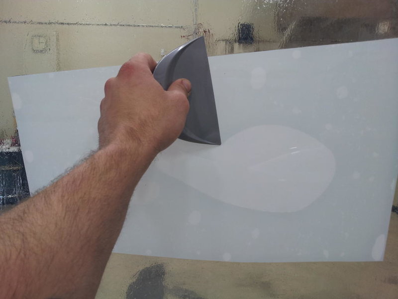 Squeegee film to glass with release liner towards glass.jpg