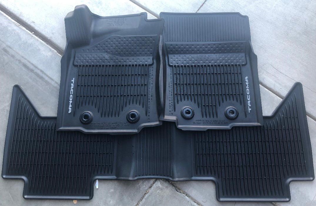 Tacoma OEM Rubber Mats (Front and Back) for manual only.jpg