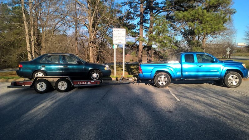 Tacoma towing Corolla 1.jpg