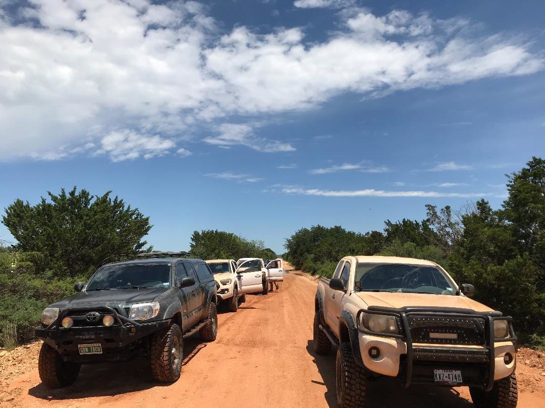 Tacomaworld Group Ride Parked on dirt road.jpg