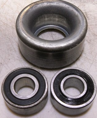 Tensioner pulley outlet bearing