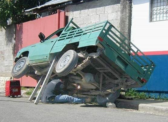 Very unsafe way to work under a truck.jpg