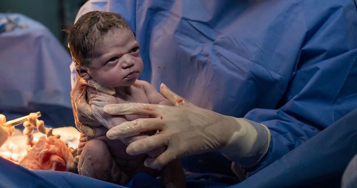 viral-photo-newborn-baby-girl-unimpressed-grumpy-face-fb2-png__700.jpg