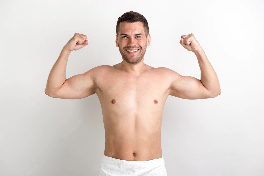 young-shirtless-man-flexing-his-muscles-against-white-wall_23-2148213295.jpg