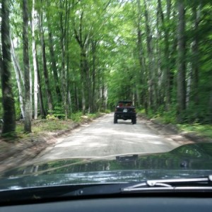 John bombing down a dirt road