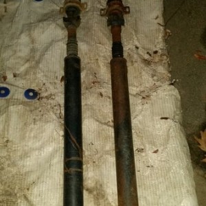 Bent driveshaft next to "new" rusty driveshaft