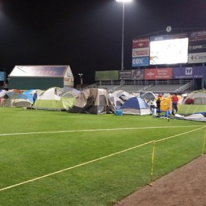 Cub Scouts camping on Pawsox field