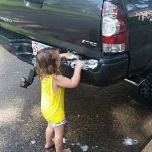 Sophia helping wash my truck