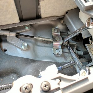 Taking the slack out of the e-brake cable.