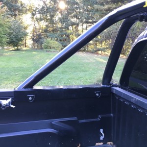 Roll bar bed rail mounts