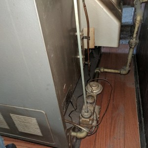 I know the silver tube feeds the gas. Looks like the vertical copper rod is a temp sensor? What's the copper wire for? It's not electric.