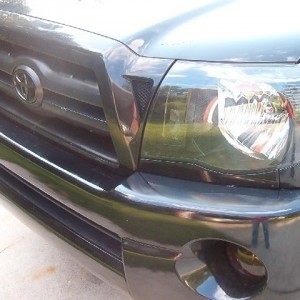 black headlights w/ tinted fogs and black T emblem